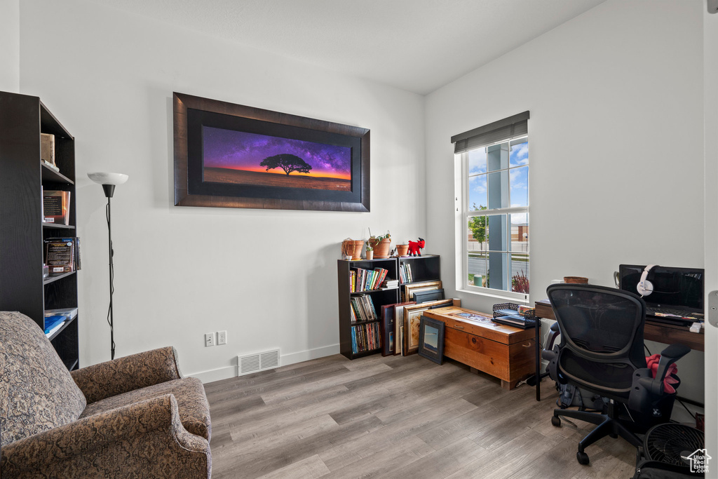 Office space featuring wood finished floors and baseboards