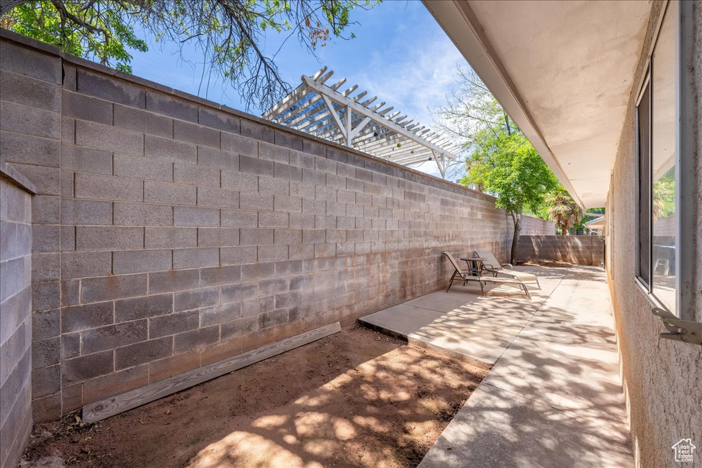 Fenced backyard featuring a patio