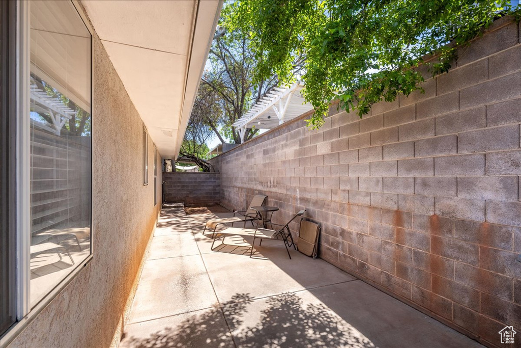 Fenced backyard featuring a patio