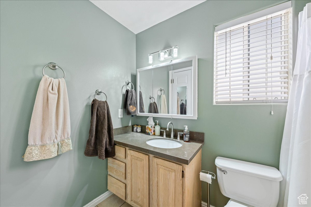 Bathroom featuring toilet and vanity