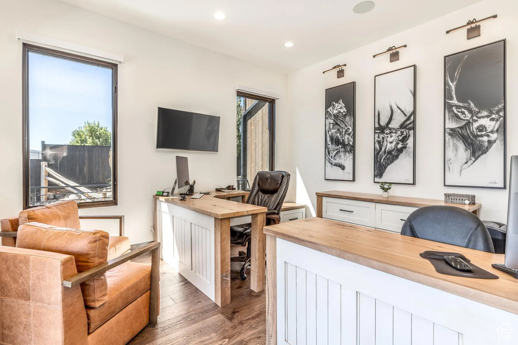 Office featuring wood finished floors and recessed lighting