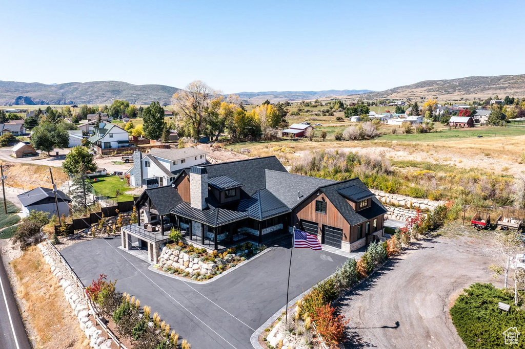 Aerial perspective of suburban area featuring a mountainous background