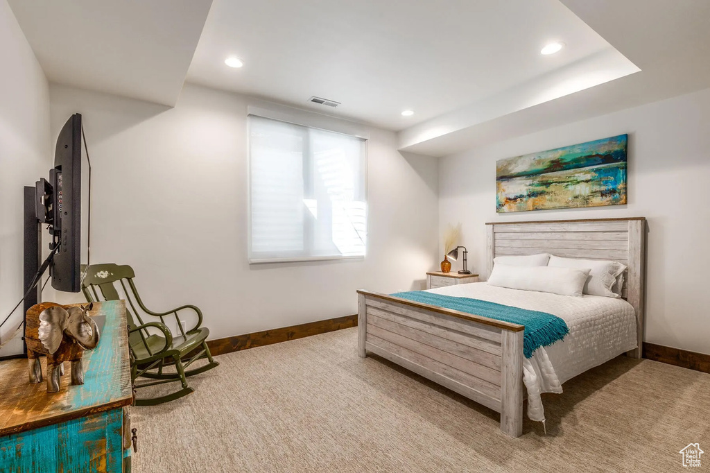 Carpeted bedroom with baseboards and recessed lighting