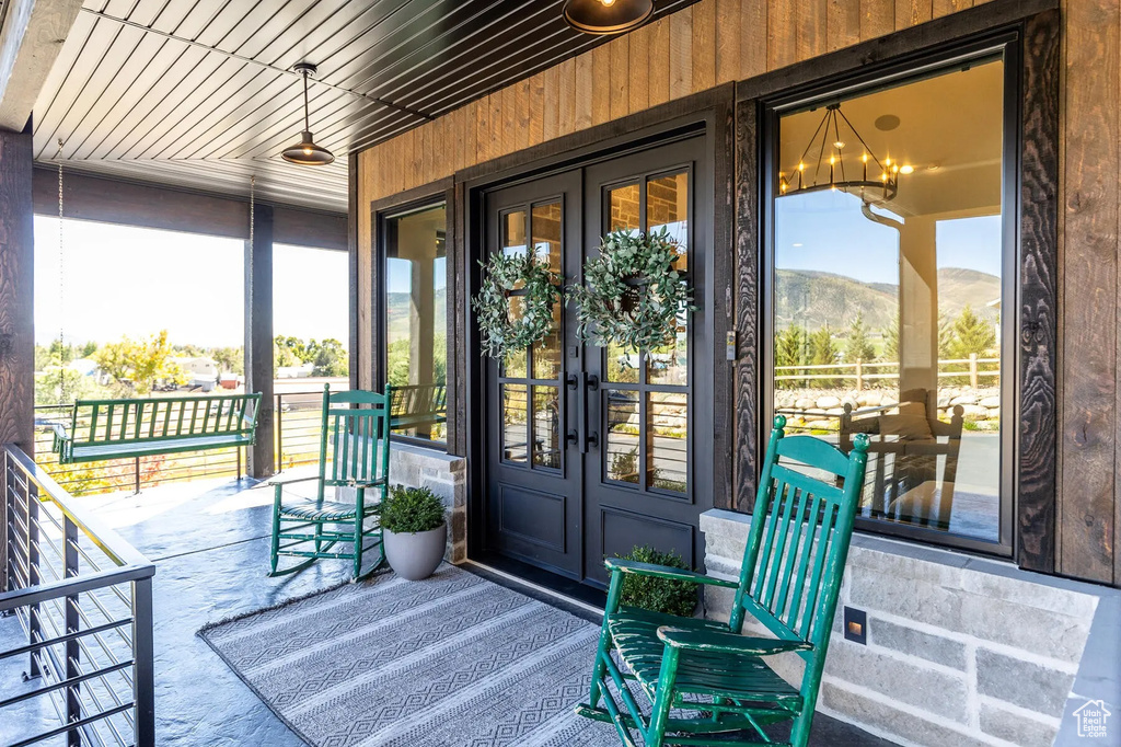 Entrance to property featuring french doors and a mountain view