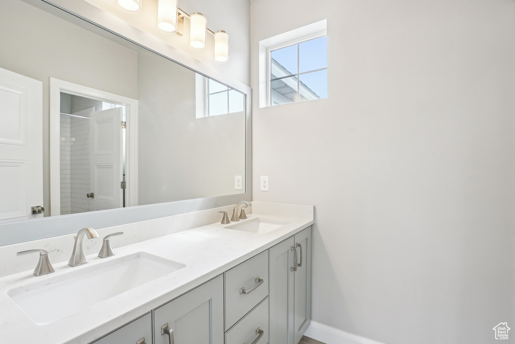 Bathroom with double vanity and a shower