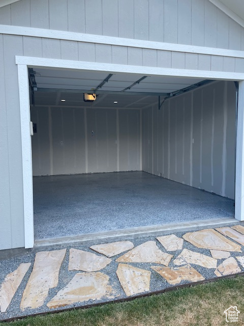 Garage featuring a garage door opener