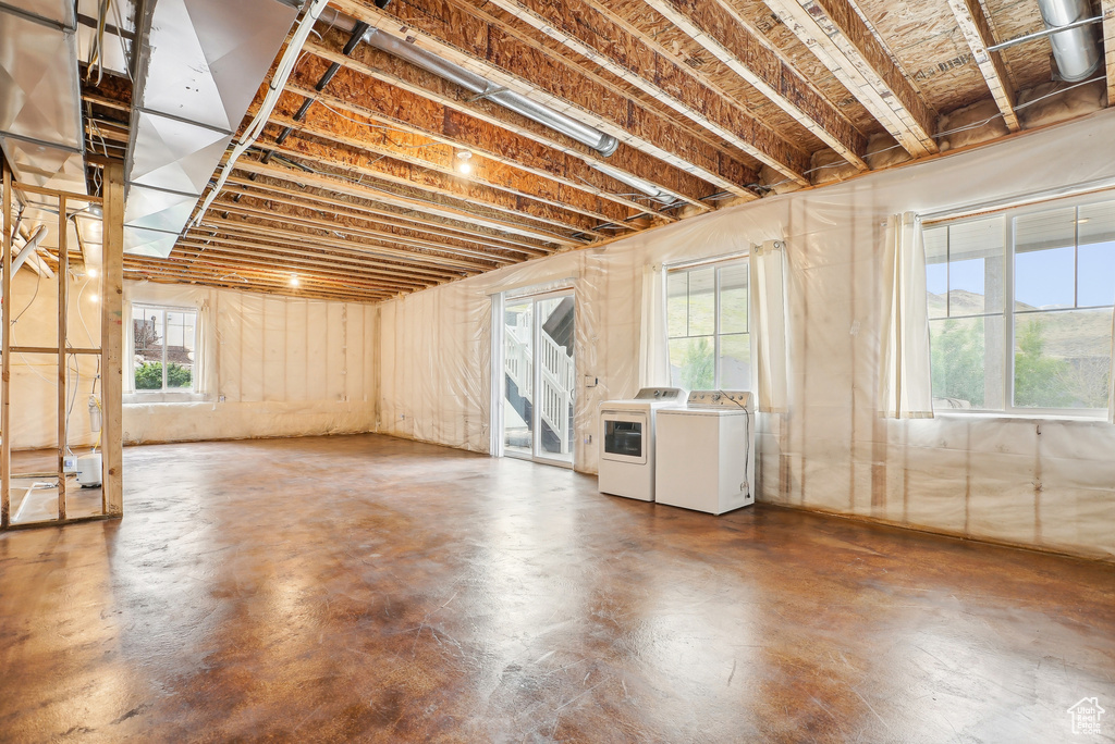 Basement featuring washing machine and clothes dryer