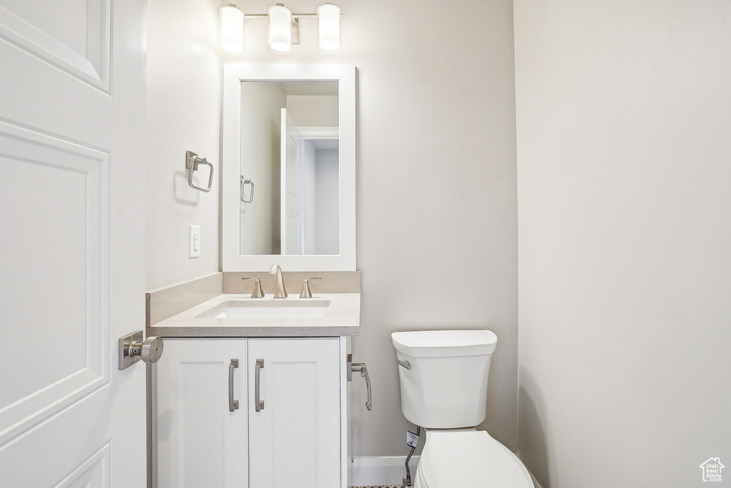 Bathroom featuring vanity and toilet