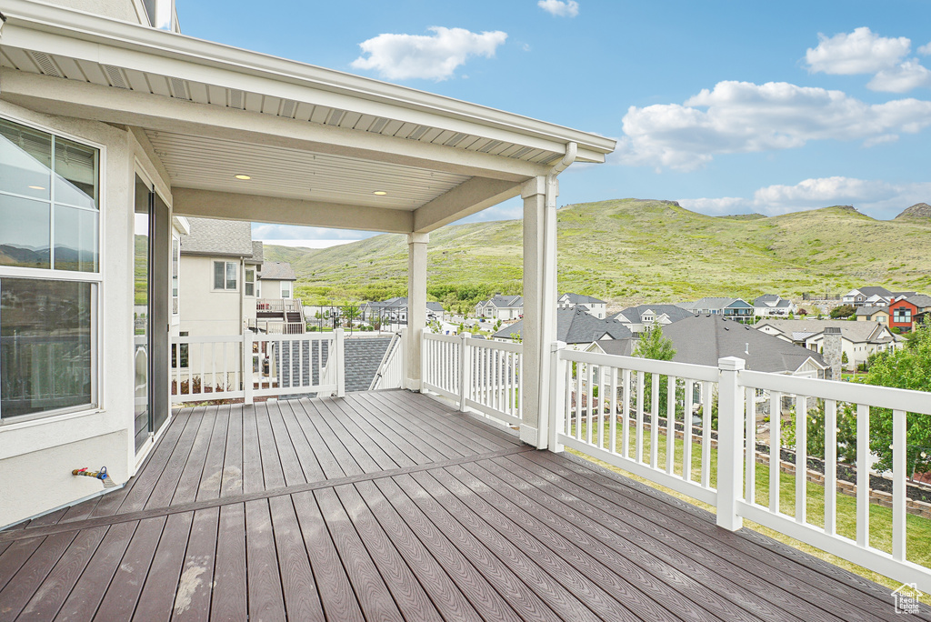 Deck featuring a residential view and a mountain view