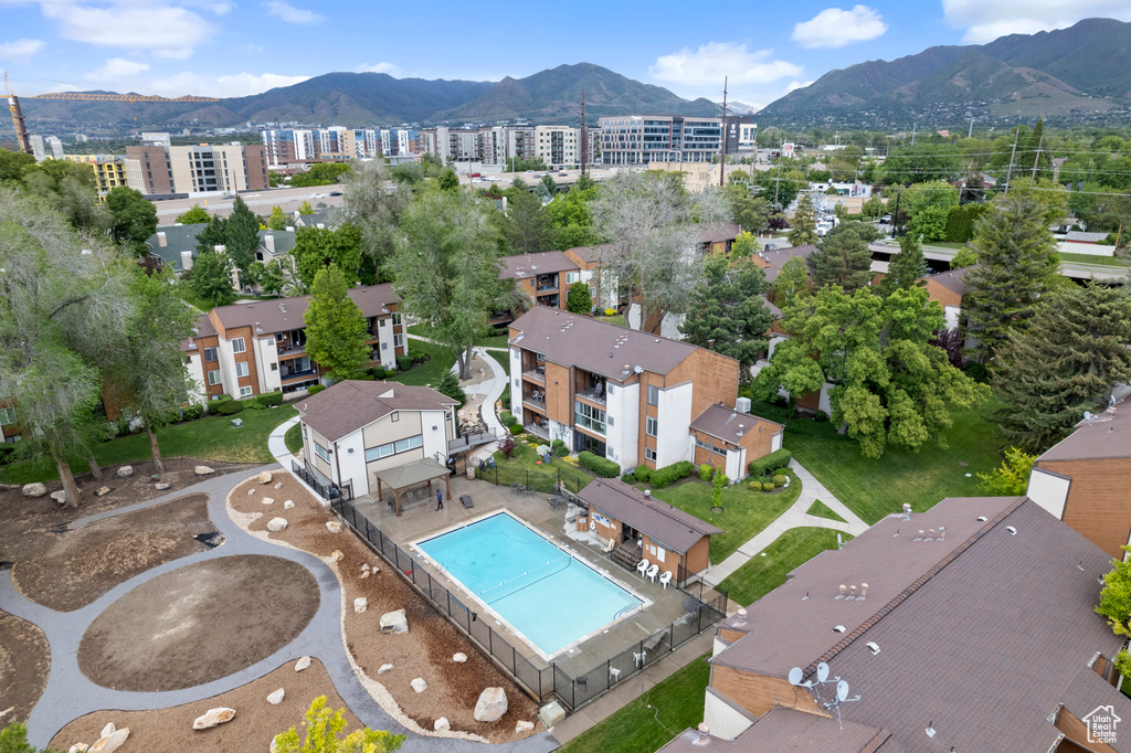 Bird's eye view of a mountainous background and a pool