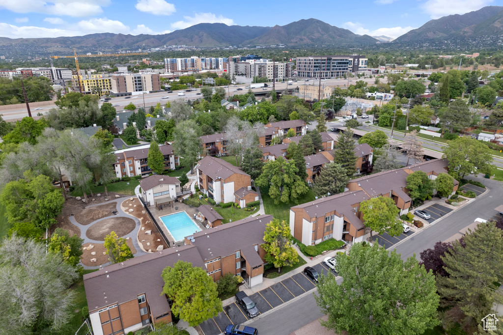 Aerial view of a mountain backdrop and a pool