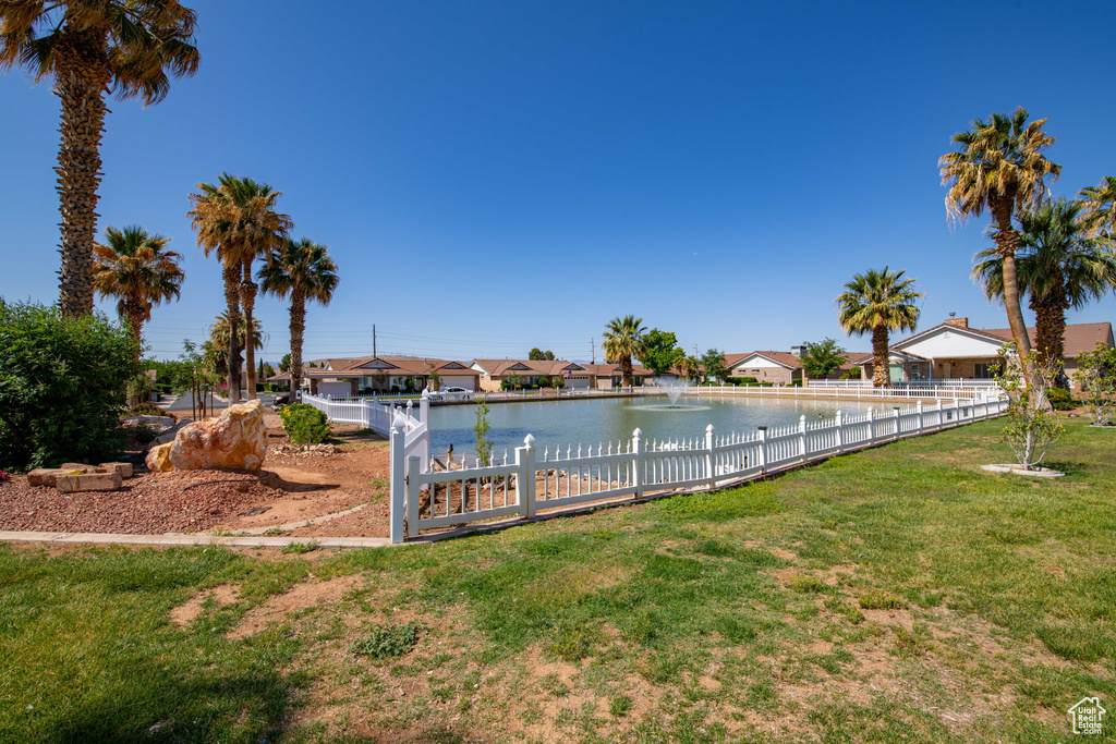 View of yard featuring a water view and a residential view