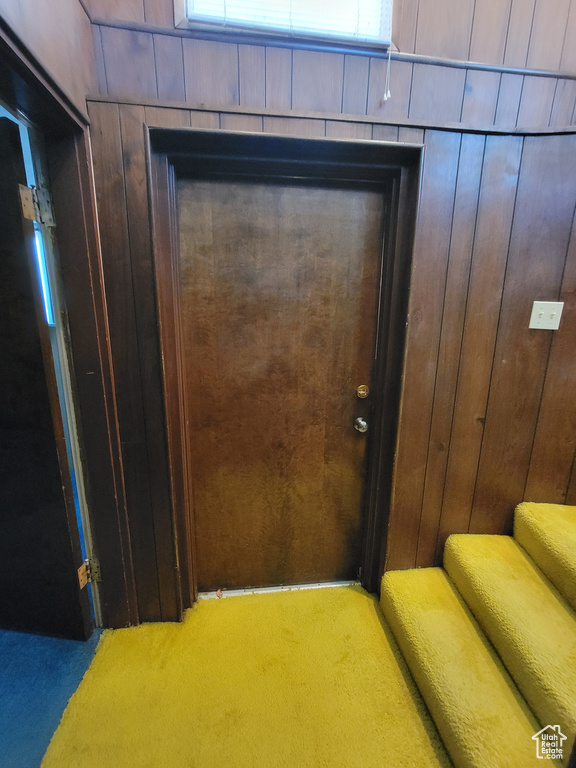 Detailed view of carpet floors and wooden walls