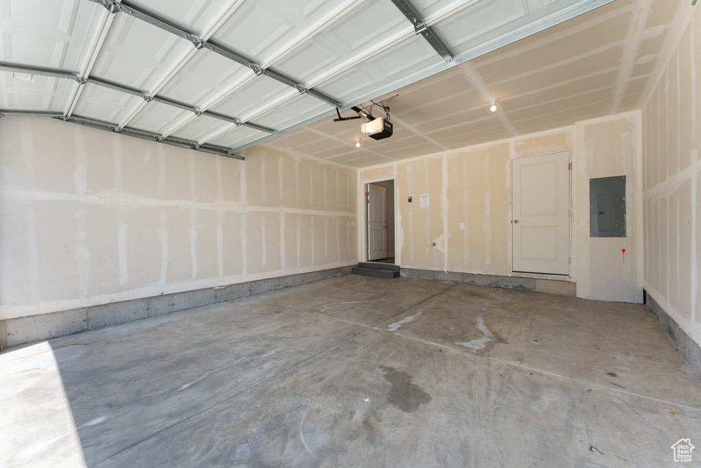 Garage with a garage door opener and electric panel