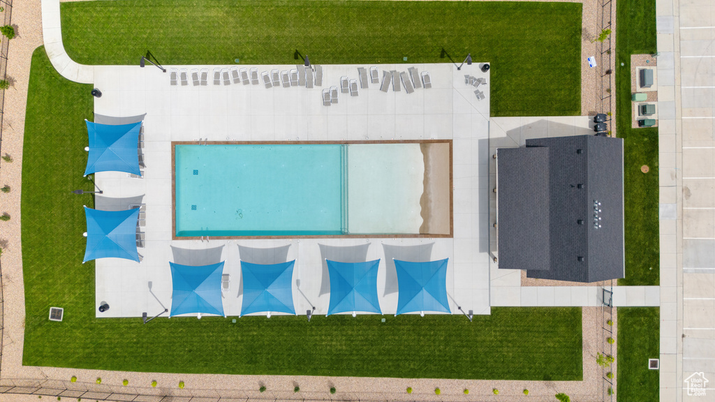 Aerial view of property and surrounding area featuring a pool