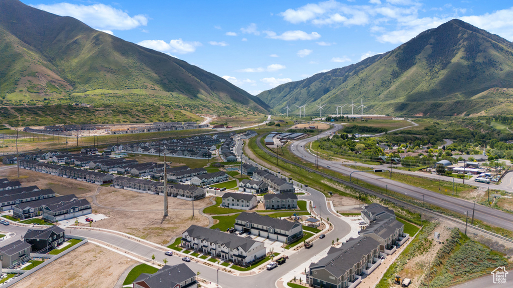 Aerial perspective of suburban area featuring a mountainous background