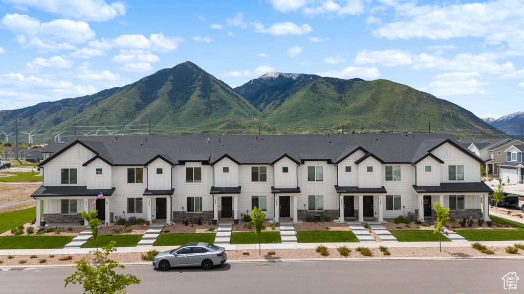 View of mountain backdrop featuring nearby suburban area