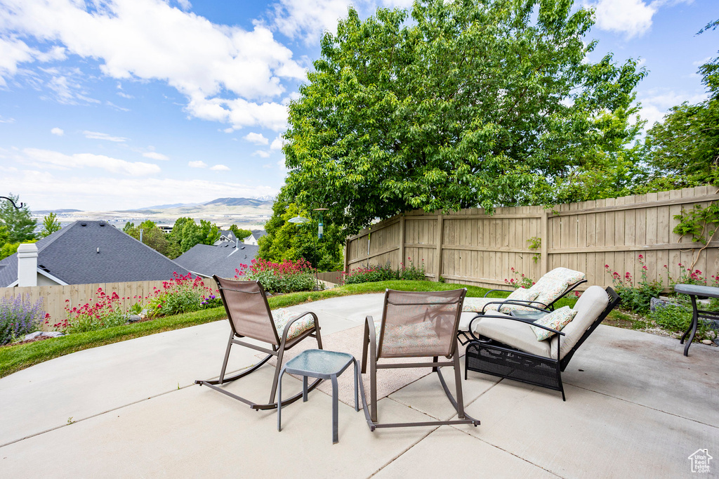 Fenced backyard with a patio and a mountain view