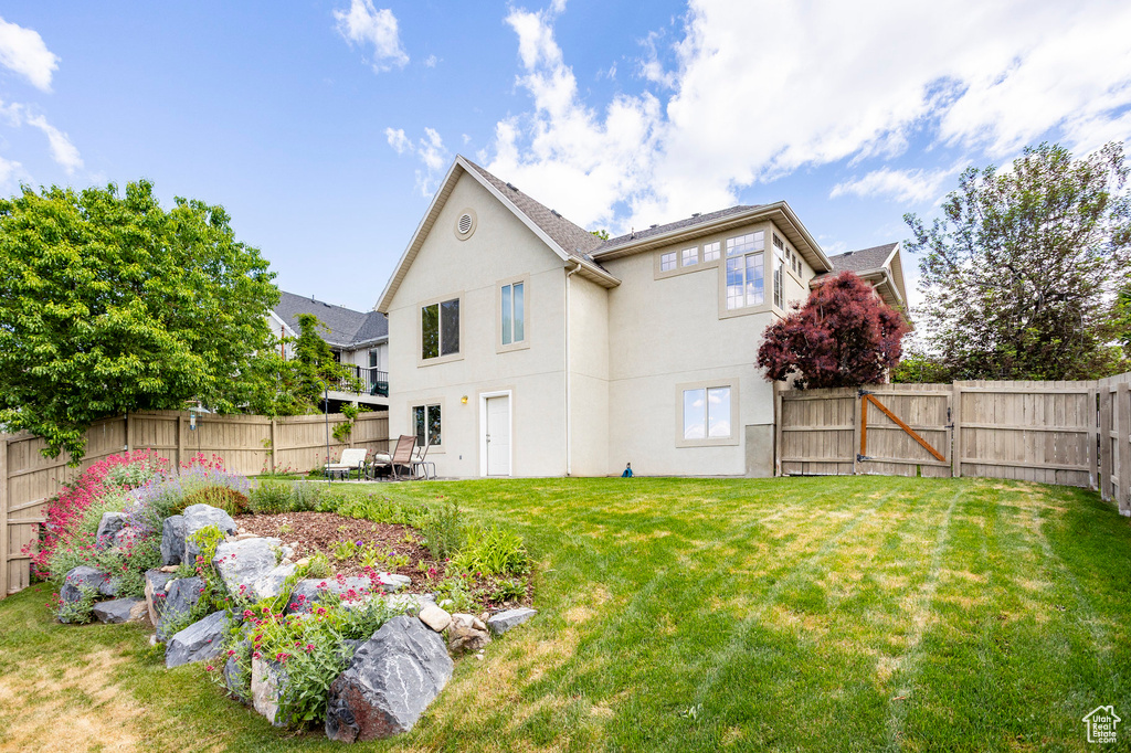 Back of property with stucco siding