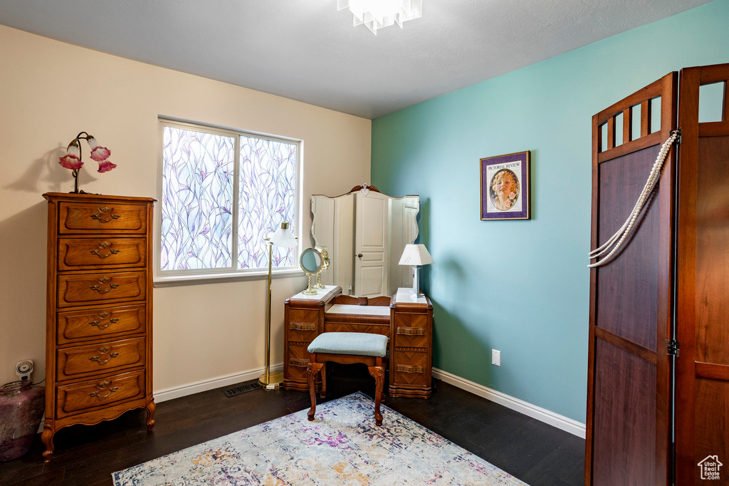Office space with wood finished floors and baseboards