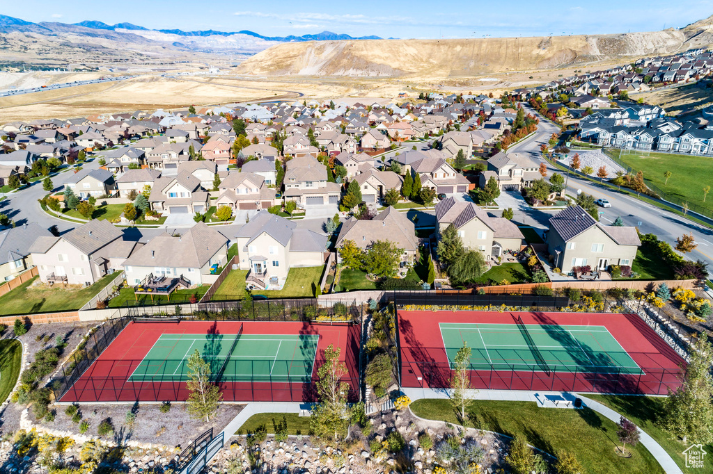 Aerial view of residential area featuring a mountain backdrop
