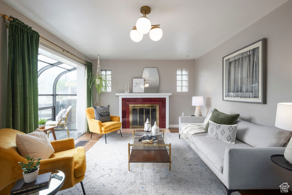 Living room with wood finished floors and a fireplace