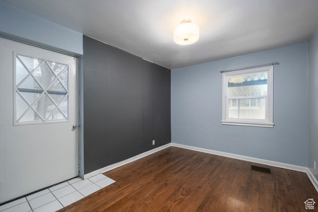 Empty room with wood finished floors and baseboards