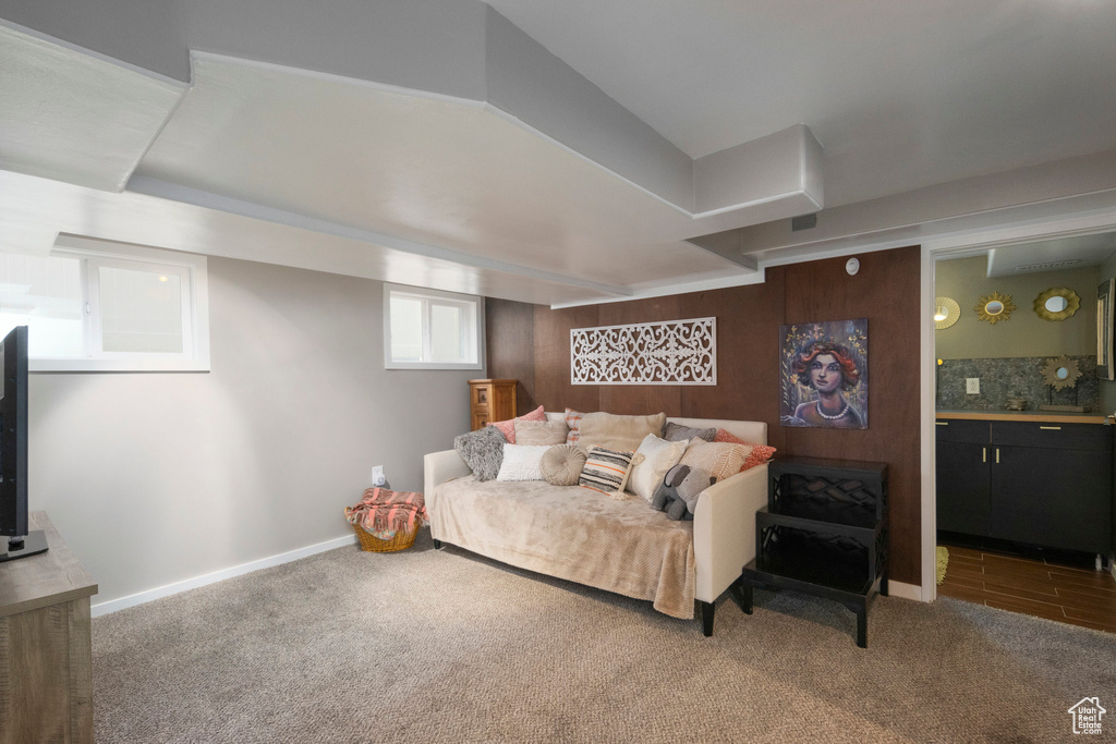 Carpeted living area with baseboards