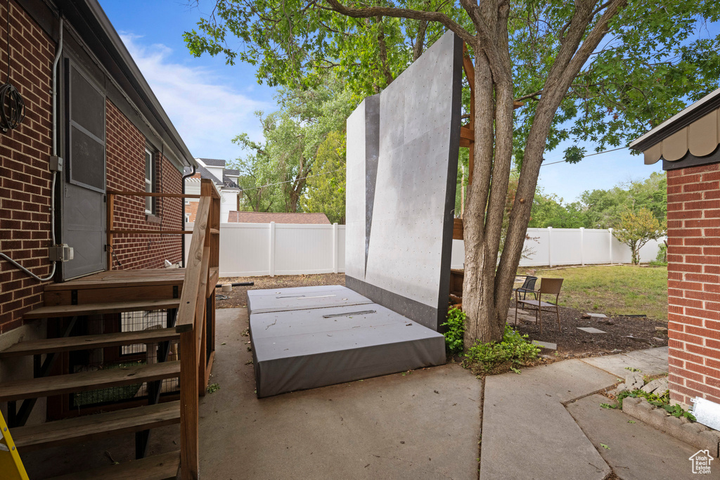Fenced backyard featuring a patio