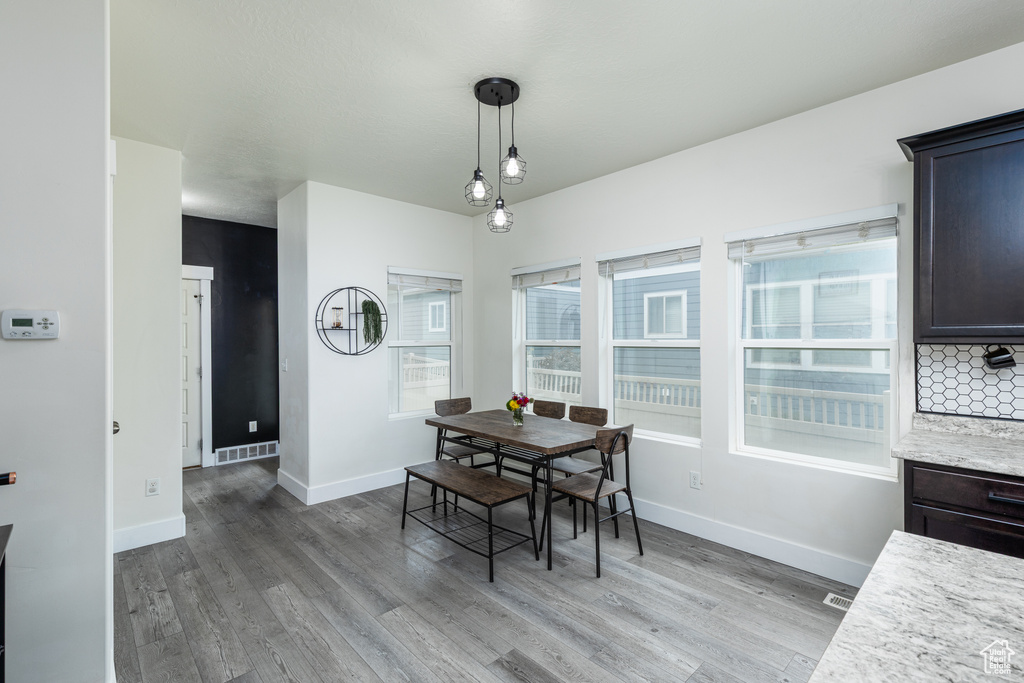 Dining area featuring light wood finished floors and baseboards