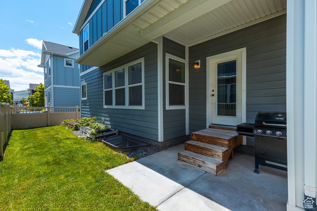 Doorway to property with board and batten siding