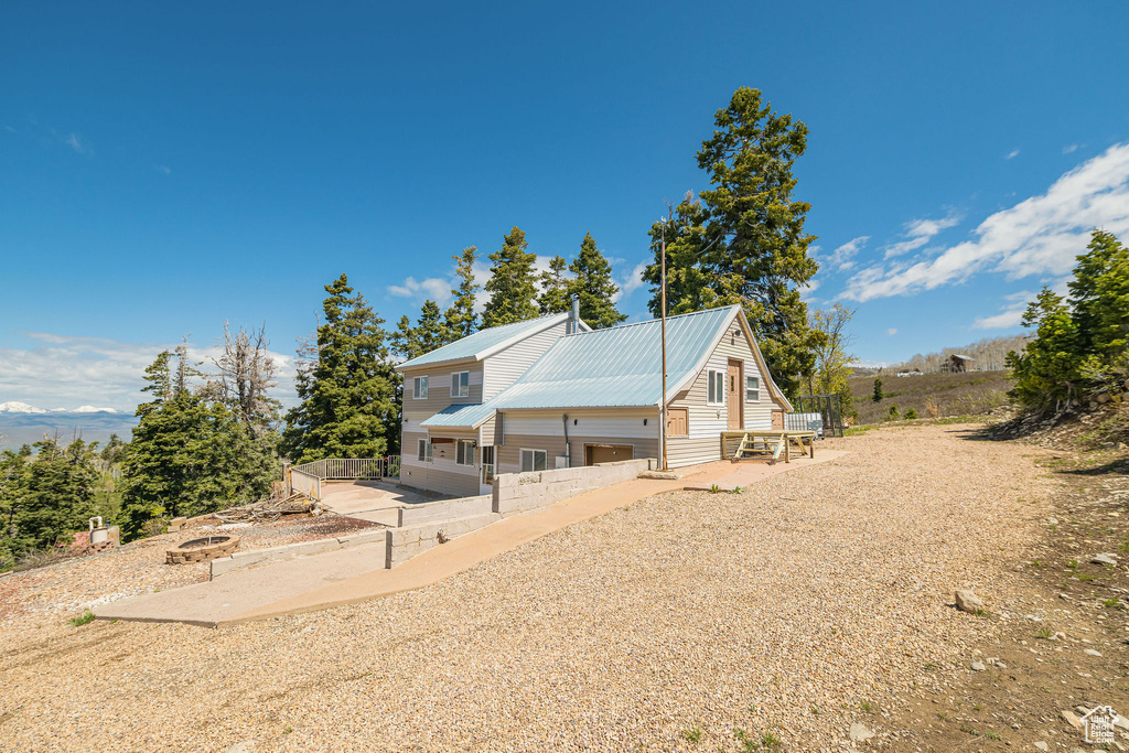 View of property exterior with metal roof