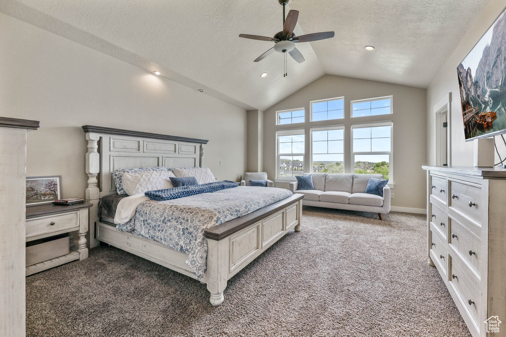 Carpeted bedroom featuring a textured ceiling, ceiling fan, high vaulted ceiling, and recessed lighting