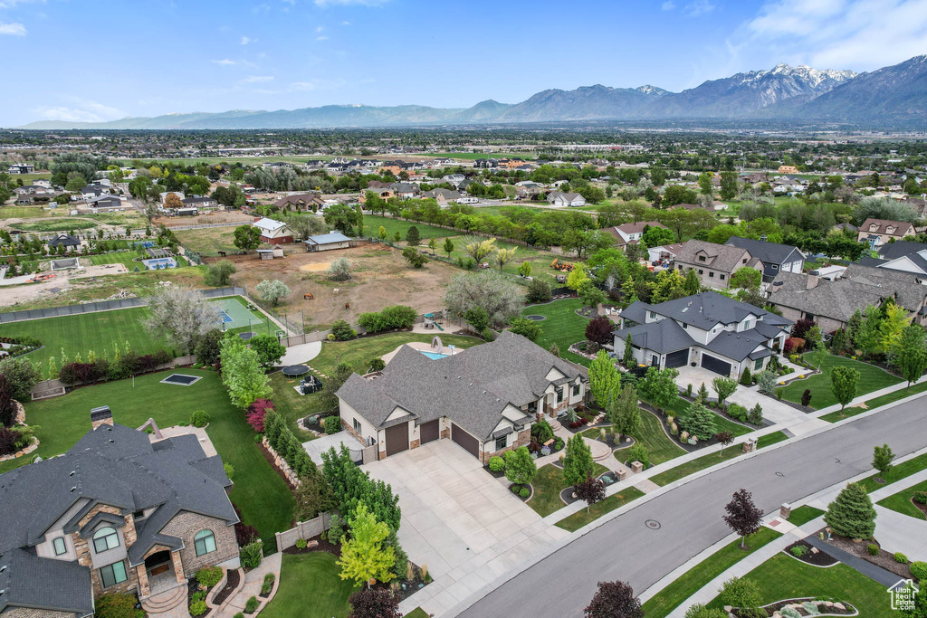 Aerial view of residential area featuring a mountain backdrop