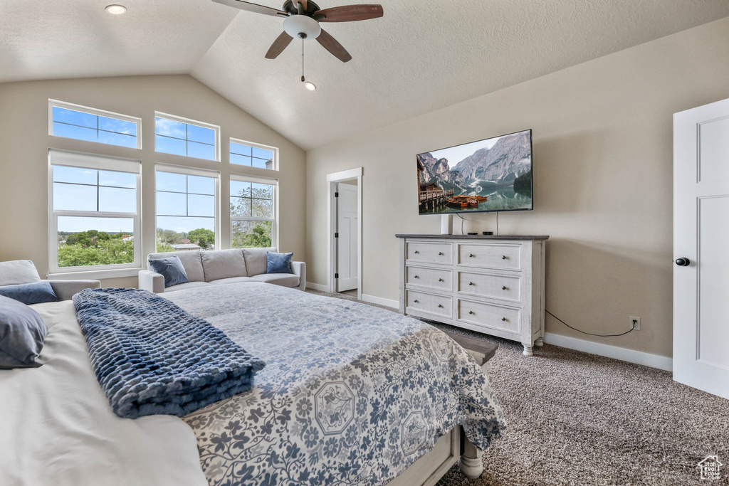 Bedroom with baseboards, lofted ceiling, carpet, and ceiling fan