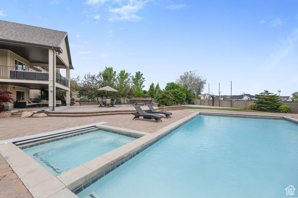 Swimming pool with a patio area
