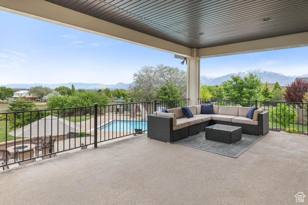 View of patio / terrace featuring outdoor lounge area, a mountain view, and a balcony