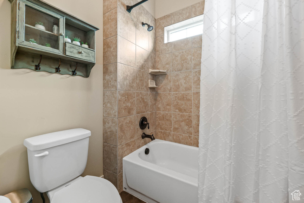 Full bath with toilet and shower / bath combo