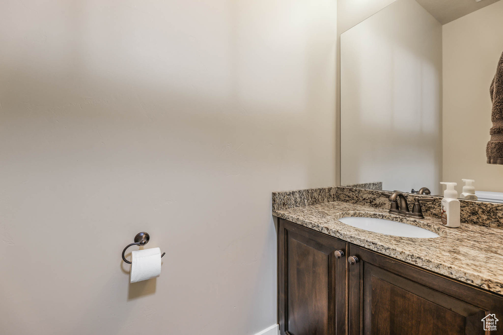 Bathroom with vanity and baseboards