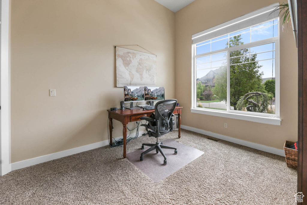 Office space featuring carpet flooring and baseboards