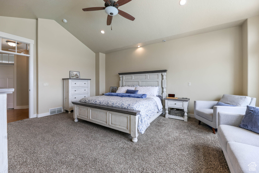 Carpeted bedroom featuring lofted ceiling, recessed lighting, baseboards, and a ceiling fan