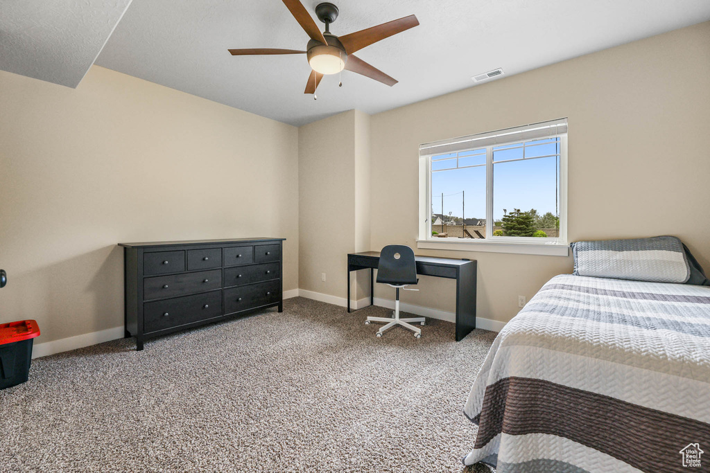 Bedroom featuring baseboards, a ceiling fan, and carpet floors