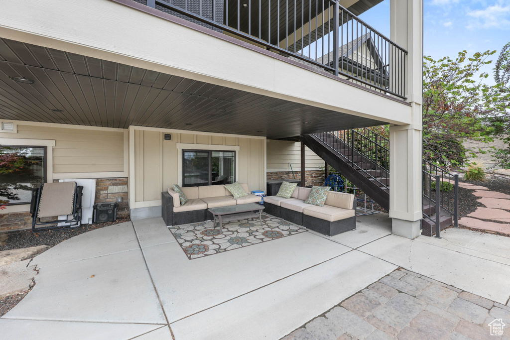 View of patio featuring an outdoor hangout area and stairway