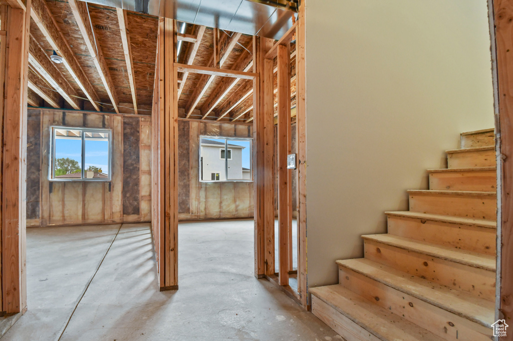 Miscellaneous room with plenty of natural light and stairs