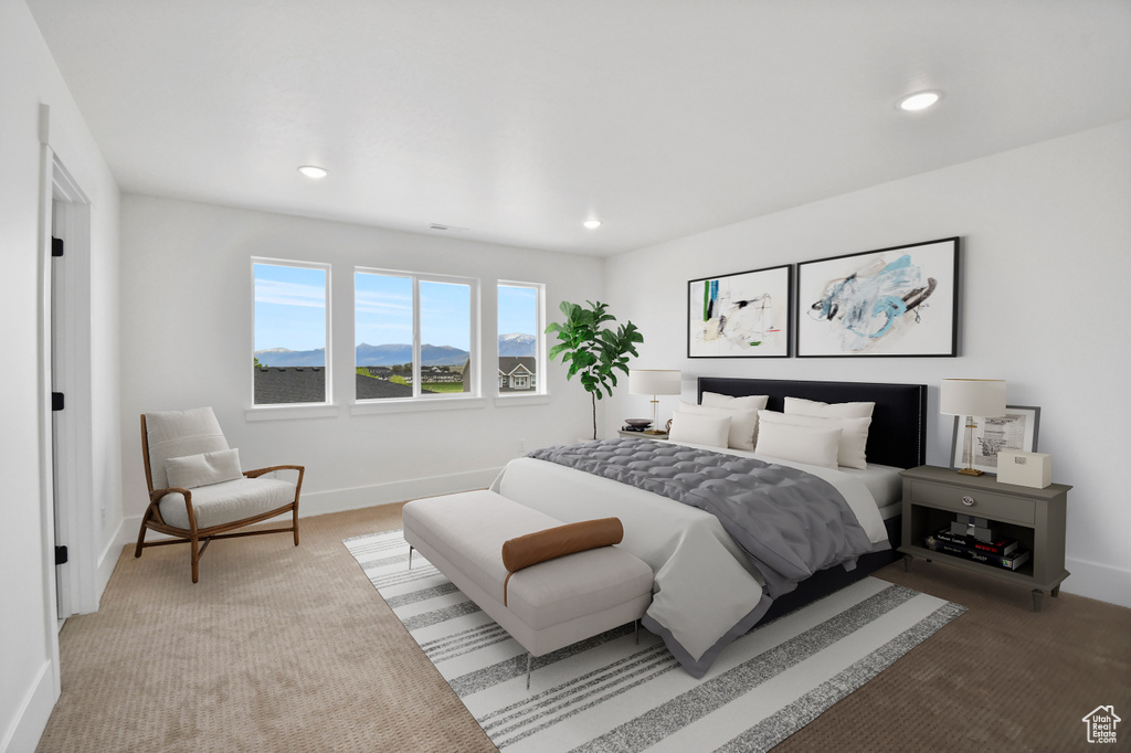 Bedroom featuring baseboards, recessed lighting, and light carpet