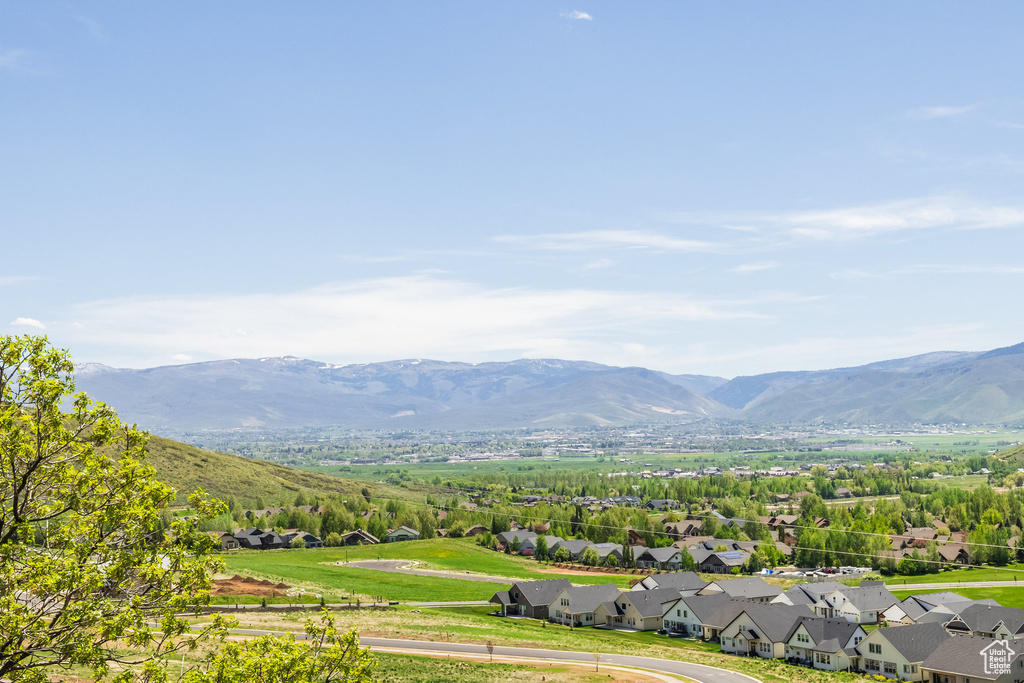 View of mountain backdrop featuring nearby suburban area
