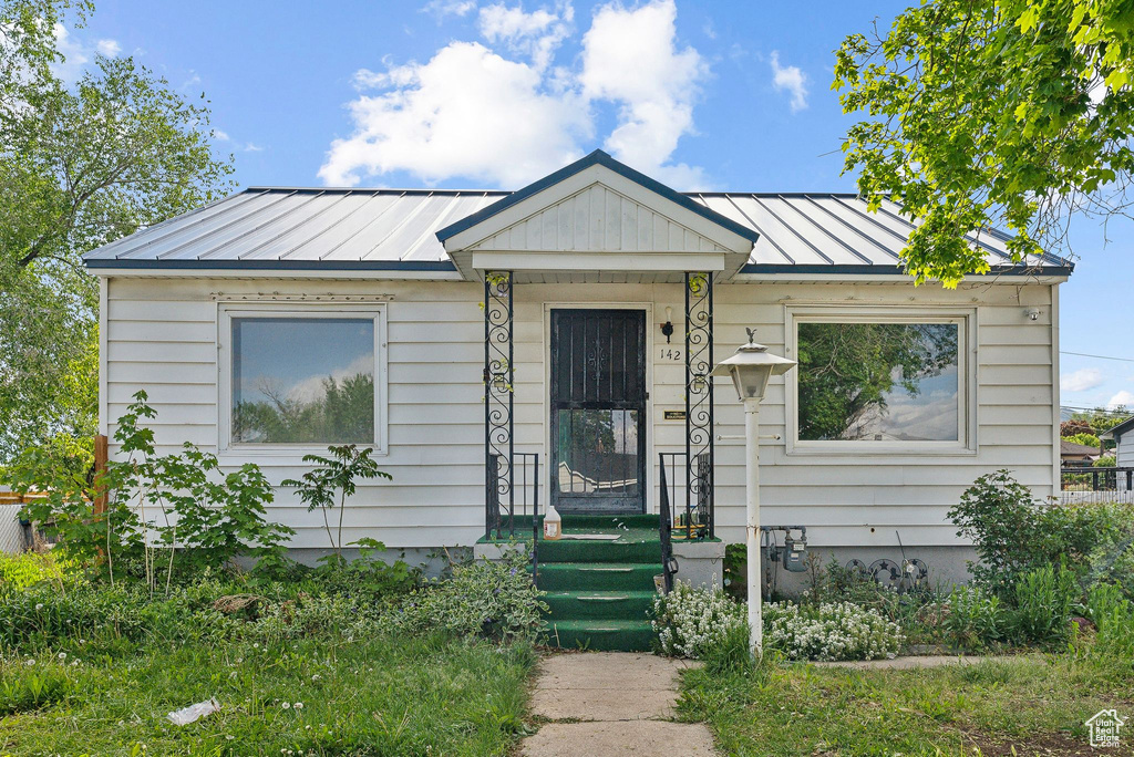 View of front facade featuring a standing seam roof and metal roof