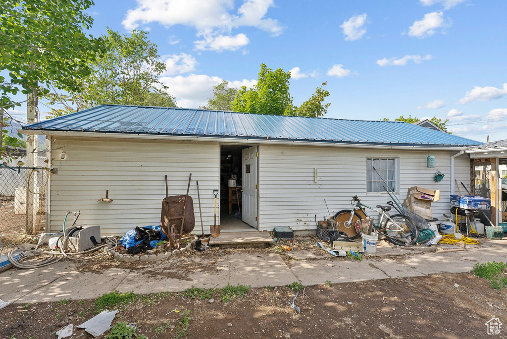 Rear view of house with metal roof