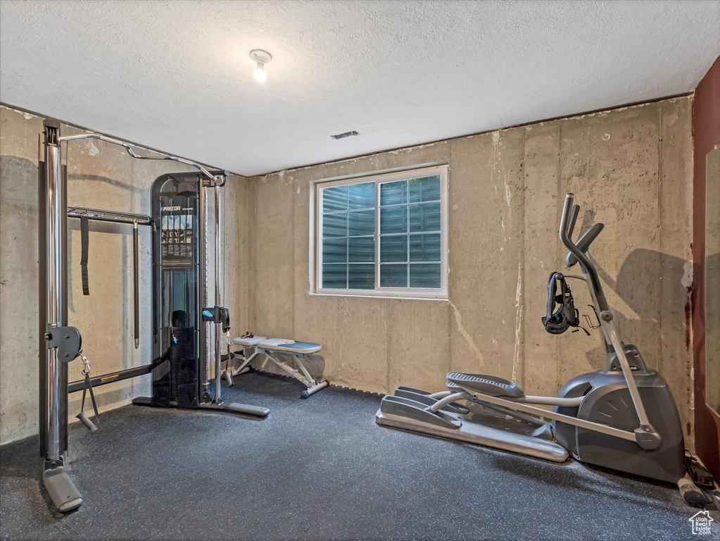 Workout area with a textured ceiling