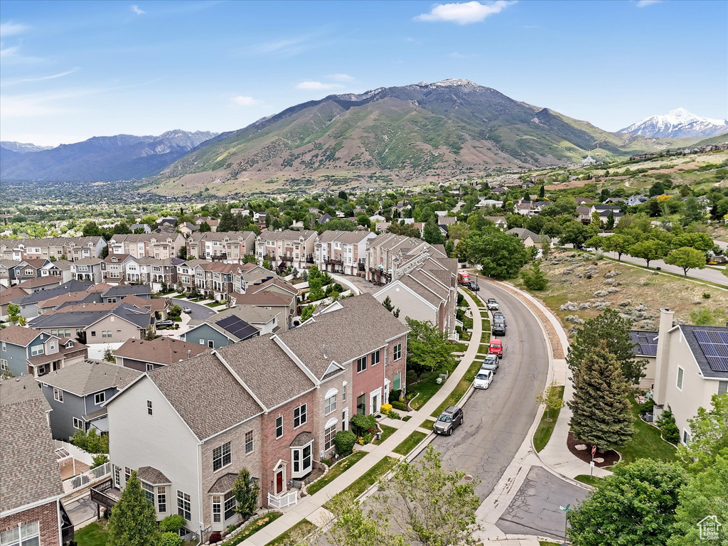 Aerial view of residential area featuring a mountain backdrop